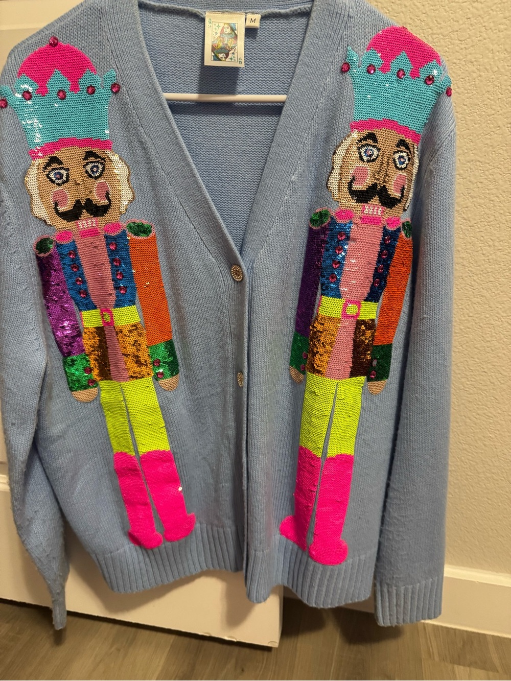 Light Blue Cardigan Sweater with Colorful Nutcracker Sequin Design